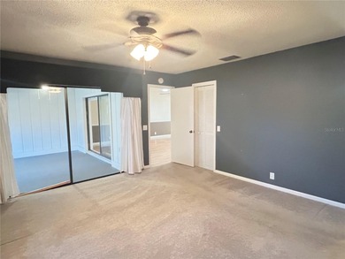 MOVE IN CONDITION!  Nestled on a beautifully landscaped and tree on Cypresswood Golf and Country Club in Florida - for sale on GolfHomes.com, golf home, golf lot