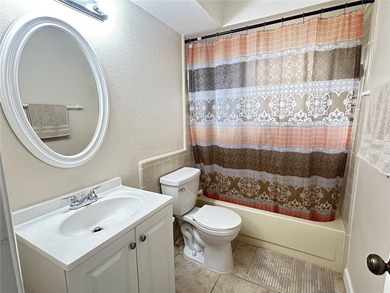 MOVE IN CONDITION!  Nestled on a beautifully landscaped and tree on Cypresswood Golf and Country Club in Florida - for sale on GolfHomes.com, golf home, golf lot