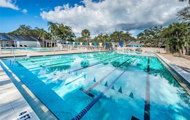 Trying to downsize but don't want to feel cramped? Step into the on East Lake Woodlands Country Club in Florida - for sale on GolfHomes.com, golf home, golf lot
