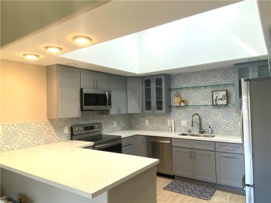 Gorgeous corner drive-up unit adorned with lovely exterior tile on Leisure World Seal Beach Golf Course in California - for sale on GolfHomes.com, golf home, golf lot