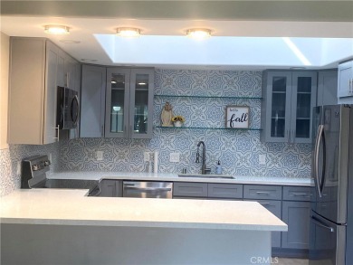 Gorgeous corner drive-up unit adorned with lovely exterior tile on Leisure World Seal Beach Golf Course in California - for sale on GolfHomes.com, golf home, golf lot