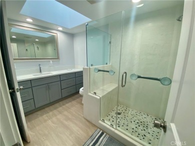 Gorgeous corner drive-up unit adorned with lovely exterior tile on Leisure World Seal Beach Golf Course in California - for sale on GolfHomes.com, golf home, golf lot