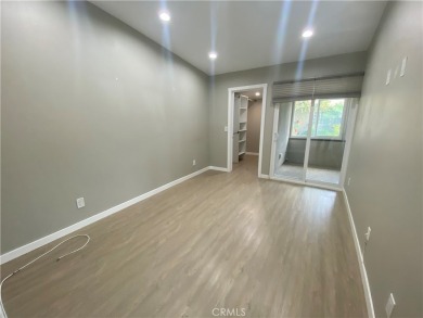 Gorgeous corner drive-up unit adorned with lovely exterior tile on Leisure World Seal Beach Golf Course in California - for sale on GolfHomes.com, golf home, golf lot