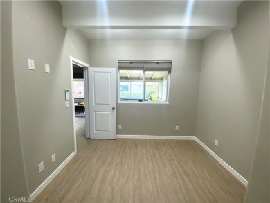 Gorgeous corner drive-up unit adorned with lovely exterior tile on Leisure World Seal Beach Golf Course in California - for sale on GolfHomes.com, golf home, golf lot