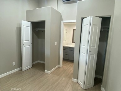Gorgeous corner drive-up unit adorned with lovely exterior tile on Leisure World Seal Beach Golf Course in California - for sale on GolfHomes.com, golf home, golf lot