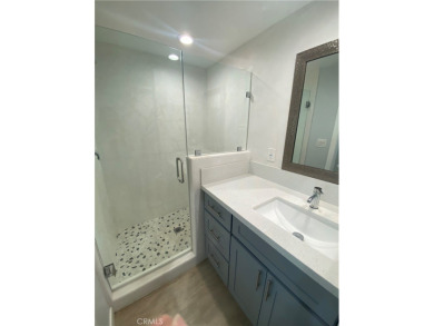 Gorgeous corner drive-up unit adorned with lovely exterior tile on Leisure World Seal Beach Golf Course in California - for sale on GolfHomes.com, golf home, golf lot