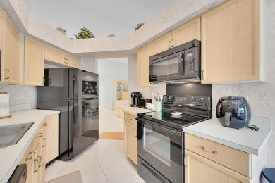 YOU'LL INSTANTLY FEEL AT HOME WHEN YOU STEP INTO THIS VAULTEDV on The Boca Country Club in Florida - for sale on GolfHomes.com, golf home, golf lot