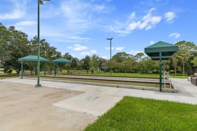 This end-unit Sea Breeze Villa nestled within Pine Meadow on Heritage Pines Country Club in Florida - for sale on GolfHomes.com, golf home, golf lot