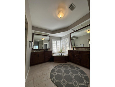 Enjoy the exceptional location of 472 Indigo Loop within the on Emerald Bay Golf Club in Florida - for sale on GolfHomes.com, golf home, golf lot