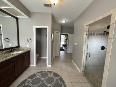 Enjoy the exceptional location of 472 Indigo Loop within the on Emerald Bay Golf Club in Florida - for sale on GolfHomes.com, golf home, golf lot