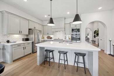 Discover luxury living in this stunning 3-bedroom, 2.5-bath home on The Tribute At the Colony in Texas - for sale on GolfHomes.com, golf home, golf lot
