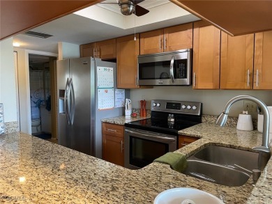 Discover this stunning 2-bedroom, 2-bath 1st-floor corner end on Hideaway Country Club in Florida - for sale on GolfHomes.com, golf home, golf lot