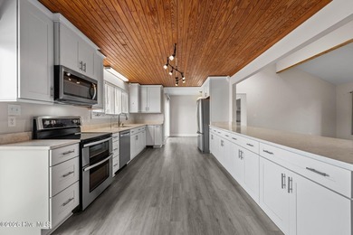 Spectacular water views from nearly every room make this home on Harbour Point Golf Club in North Carolina - for sale on GolfHomes.com, golf home, golf lot