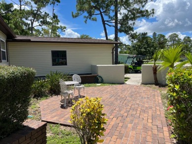 This home needs a little TLC and is priced at $25,000 for a on Pine Lakes Country Club in Florida - for sale on GolfHomes.com, golf home, golf lot