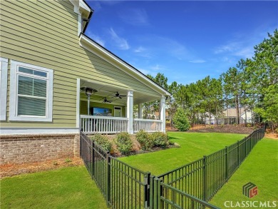 Welcome to this sought after double sided walkway gated on Monroe Golf and Country Club in Georgia - for sale on GolfHomes.com, golf home, golf lot