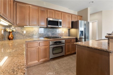 Welcome to this spacious 5-bedroom, 3-bathroom home in the on Menifee Lakes Country Club - Lakes in California - for sale on GolfHomes.com, golf home, golf lot