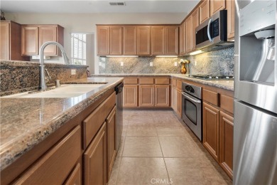 Welcome to this spacious 5-bedroom, 3-bathroom home in the on Menifee Lakes Country Club - Lakes in California - for sale on GolfHomes.com, golf home, golf lot