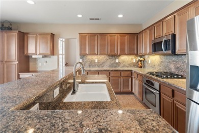Welcome to this spacious 5-bedroom, 3-bathroom home in the on Menifee Lakes Country Club - Lakes in California - for sale on GolfHomes.com, golf home, golf lot