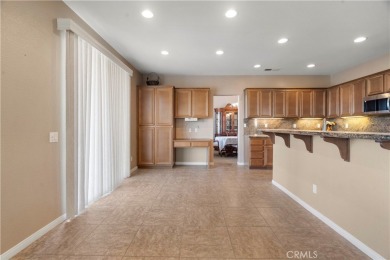 Welcome to this spacious 5-bedroom, 3-bathroom home in the on Menifee Lakes Country Club - Lakes in California - for sale on GolfHomes.com, golf home, golf lot