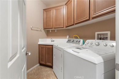 Welcome to this spacious 5-bedroom, 3-bathroom home in the on Menifee Lakes Country Club - Lakes in California - for sale on GolfHomes.com, golf home, golf lot