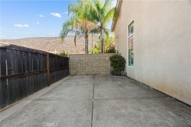 Welcome to this spacious 5-bedroom, 3-bathroom home in the on Menifee Lakes Country Club - Lakes in California - for sale on GolfHomes.com, golf home, golf lot