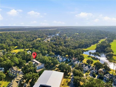 This beautifully updated first-floor, end-unit condominium on The King and Prince Golf Course, Home of the Hampton Club in Georgia - for sale on GolfHomes.com, golf home, golf lot