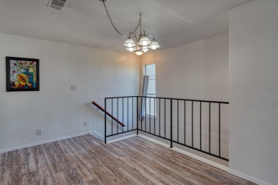 Complete with a Stair Lift to the main living space. Open floor on Arroyo Del Oso Golf Course in New Mexico - for sale on GolfHomes.com, golf home, golf lot