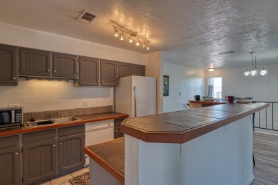 Complete with a Stair Lift to the main living space. Open floor on Arroyo Del Oso Golf Course in New Mexico - for sale on GolfHomes.com, golf home, golf lot