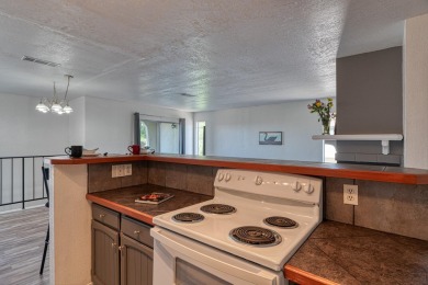 Complete with a Stair Lift to the main living space. Open floor on Arroyo Del Oso Golf Course in New Mexico - for sale on GolfHomes.com, golf home, golf lot