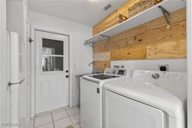 ***Rare Find! Stunning Lakefront Pool Home in SE Cape Coral - A on El Rio Golf Course and Club in Florida - for sale on GolfHomes.com, golf home, golf lot