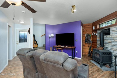 Tucked among towering pines, this inviting cabin offers the calm on Torreon Golf Club in Arizona - for sale on GolfHomes.com, golf home, golf lot