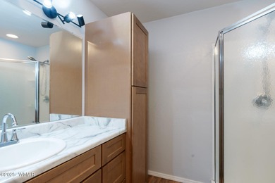 Tucked among towering pines, this inviting cabin offers the calm on Torreon Golf Club in Arizona - for sale on GolfHomes.com, golf home, golf lot