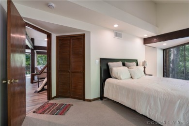 Tucked among mature trees, this unique beautifully updated on Seasons Ridge At Four Seasons in Missouri - for sale on GolfHomes.com, golf home, golf lot