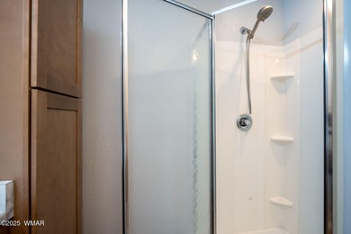 Tucked among towering pines, this inviting cabin offers the calm on Torreon Golf Club in Arizona - for sale on GolfHomes.com, golf home, golf lot