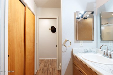 Tucked among towering pines, this inviting cabin offers the calm on Torreon Golf Club in Arizona - for sale on GolfHomes.com, golf home, golf lot