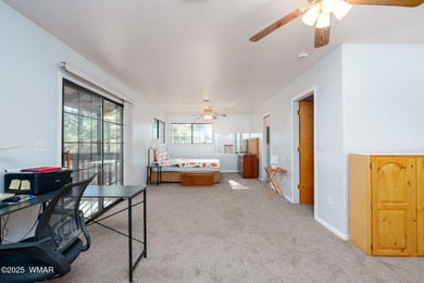 Tucked among towering pines, this inviting cabin offers the calm on Torreon Golf Club in Arizona - for sale on GolfHomes.com, golf home, golf lot