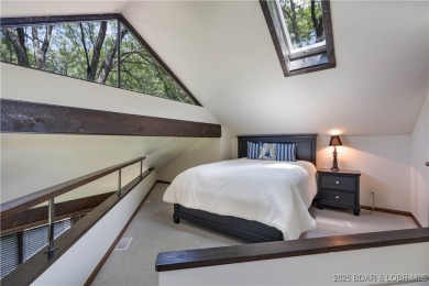 Tucked among mature trees, this unique beautifully updated on Seasons Ridge At Four Seasons in Missouri - for sale on GolfHomes.com, golf home, golf lot