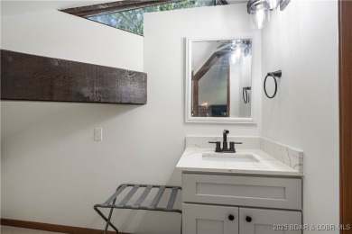 Tucked among mature trees, this unique beautifully updated on Seasons Ridge At Four Seasons in Missouri - for sale on GolfHomes.com, golf home, golf lot