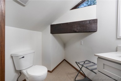 Tucked among mature trees, this unique beautifully updated on Seasons Ridge At Four Seasons in Missouri - for sale on GolfHomes.com, golf home, golf lot
