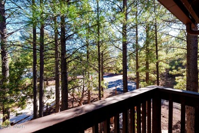 Tucked among towering pines, this inviting cabin offers the calm on Torreon Golf Club in Arizona - for sale on GolfHomes.com, golf home, golf lot