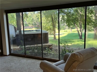 Tucked among mature trees, this unique beautifully updated on Seasons Ridge At Four Seasons in Missouri - for sale on GolfHomes.com, golf home, golf lot