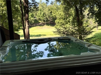 Tucked among mature trees, this unique beautifully updated on Seasons Ridge At Four Seasons in Missouri - for sale on GolfHomes.com, golf home, golf lot