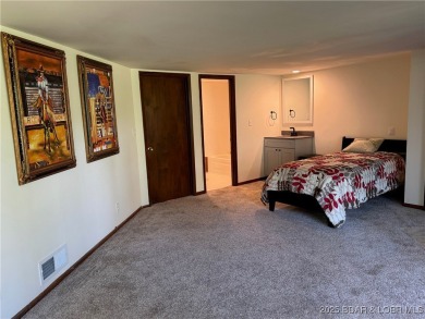 Tucked among mature trees, this unique beautifully updated on Seasons Ridge At Four Seasons in Missouri - for sale on GolfHomes.com, golf home, golf lot