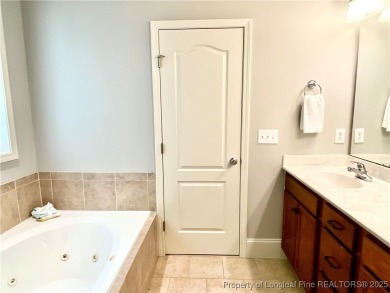 LOW MAINTENANCE LIVING CARRIAGE HOME IN GATED ANDERSON CREEK on Anderson Creek Golf Club in North Carolina - for sale on GolfHomes.com, golf home, golf lot