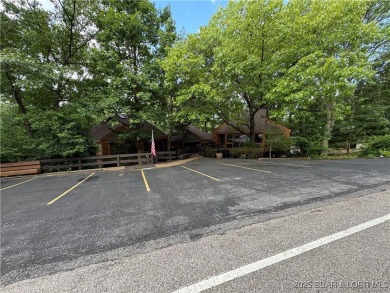 Tucked among mature trees, this unique beautifully updated on Seasons Ridge At Four Seasons in Missouri - for sale on GolfHomes.com, golf home, golf lot