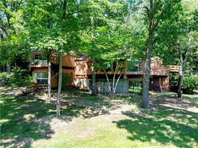 Tucked among mature trees, this unique beautifully updated on Seasons Ridge At Four Seasons in Missouri - for sale on GolfHomes.com, golf home, golf lot