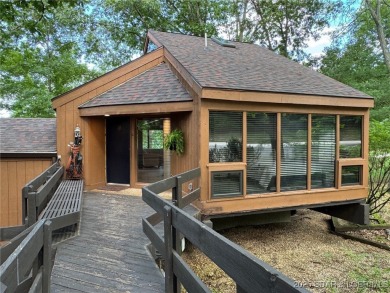 Tucked among mature trees, this unique beautifully updated on Seasons Ridge At Four Seasons in Missouri - for sale on GolfHomes.com, golf home, golf lot