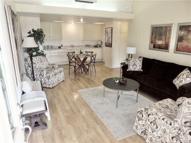 Charming and expanded one-bedroom, one-bathroom cottage nestled on Leisure World Seal Beach Golf Course in California - for sale on GolfHomes.com, golf home, golf lot