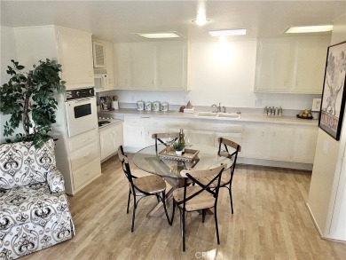 Charming and expanded one-bedroom, one-bathroom cottage nestled on Leisure World Seal Beach Golf Course in California - for sale on GolfHomes.com, golf home, golf lot