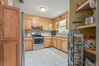 All Brick, 3 bedroom, 2 bathroom home located within the on Tanglewood Golf Club in Florida - for sale on GolfHomes.com, golf home, golf lot